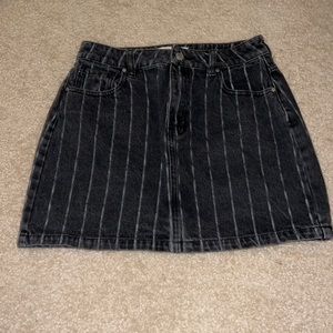 Black denim striped skirt. Short/ above knee length (depending on height).